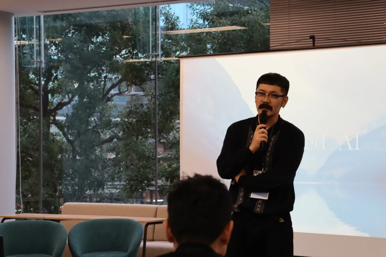 Closed AI 2024 event speaker with microphone