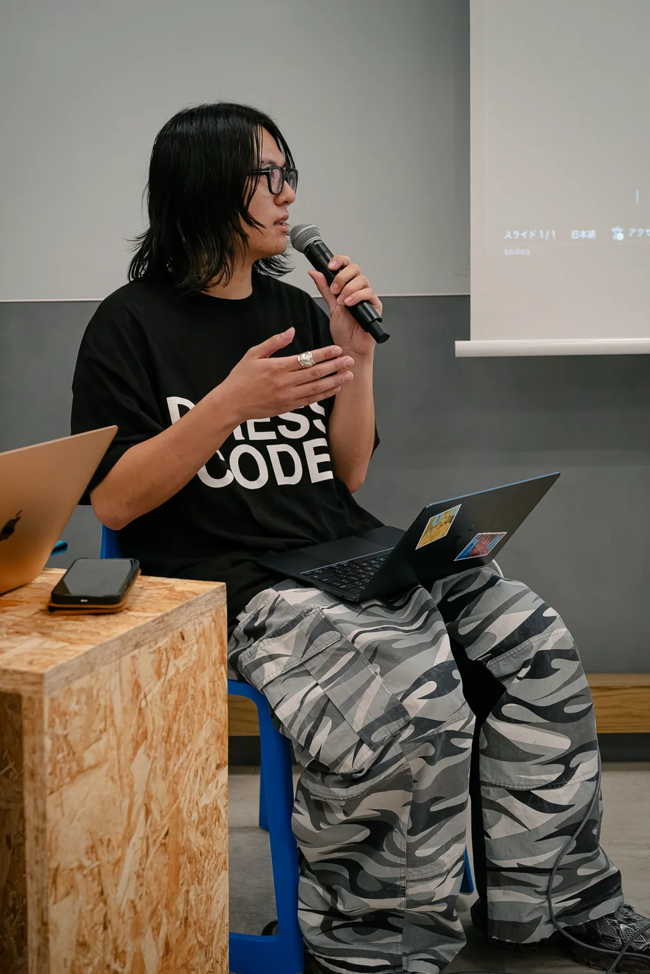 Speaker discussing development at an LR event